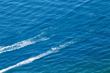 Naklejka premium trace from a boat on the surface of the water