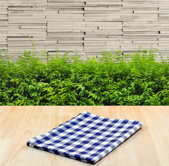blue tablecloth on wood material background for product display.