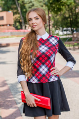 young girl in sweater posing on the street, the portrait mood, s