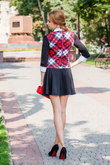 young girl in sweater posing on the street, the portrait mood, s