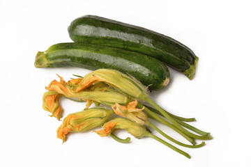 Zucchini and organic flowers on a white background