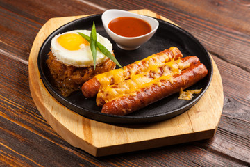 sausages in a pan with cheese