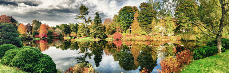 Beautiful lake and colourful trees of New England at foliage sea