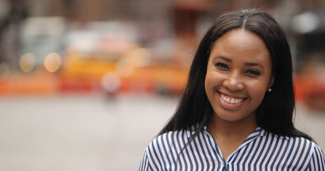 Young black woman in city smile happy face portrait
