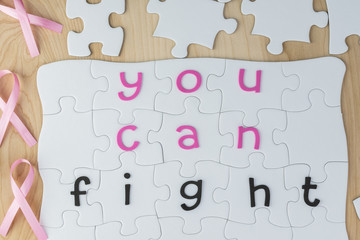 Copmlete puzzle with fight cancer inspirational quote about brea