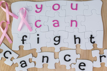 Copmlete puzzle with fight cancer inspirational quote about brea