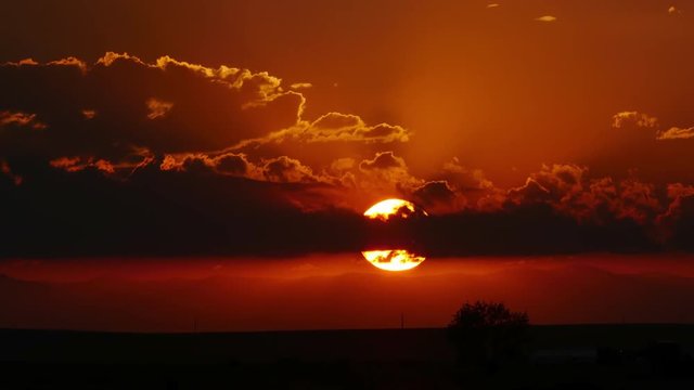 Telephoto scene of Sunset over Rural Colorado. 4K UHD time-lapse.