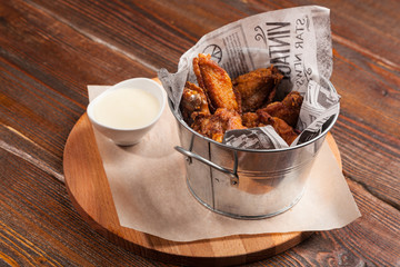 chicken wings in a bucket © Amikphoto