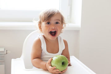Baby eating fruit