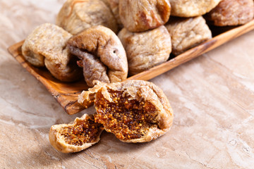  dried figs in wooden dish