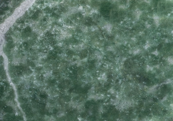 Surface of the mineral chrysoprase, included in the chalcedony group. It is a microcrystalline variety of quartz green in colour.