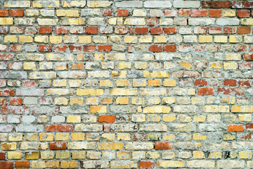 Background / Brick wall with red and yellow stones