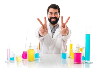 Scientist man doing victory gesture