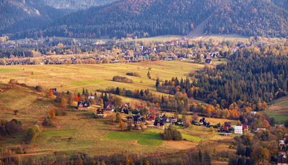 Fototapeta premium Sunny October day in mountain village. Autumn in Poland