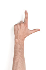 Close up view of a man's hand touching something with his forefinger isolated on white background