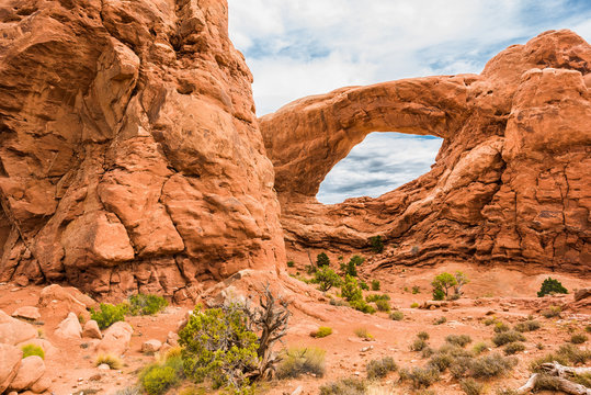 One window arch in national park with cloudy sky