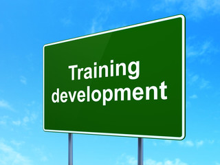 Studying concept: Training Development on road sign background