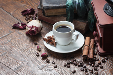 Cup of coffee, dry rose and old telephone