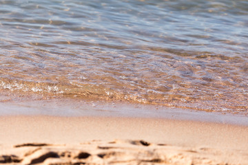 Fototapeta na wymiar sandy shore of the sea as a backdrop
