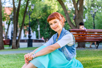 Girl sitting on the grass in the park