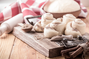 Making cinnamon buns. Homemade yeast dough after raising