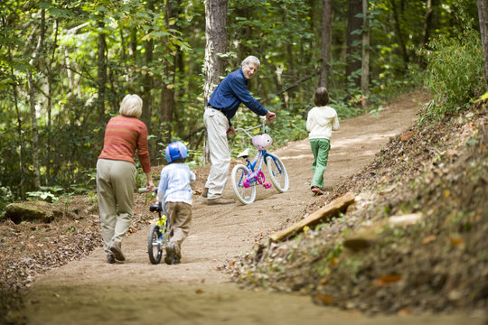 A family with their bikes in the woods