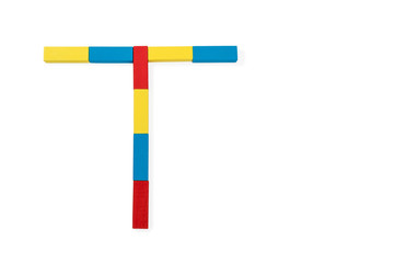 Letter T is folded of wooden blocks