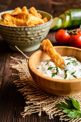 Deep - fried zucchini fries with sour cream dipping sauce