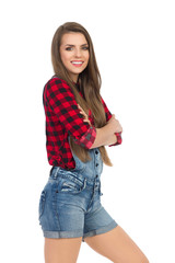 Cheerful Woman In Lumberjack Shirt With Arms Crossed