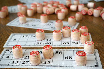 Tabletop lotto game with wooden elements. Keywords: win! Victory!
