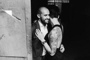 man and woman hugging in the doorway