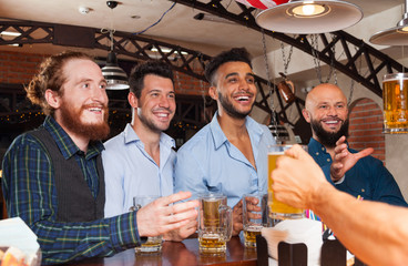 Man Group In Bar Hold Beer Glasses, Standing At Counter Order Barman, Mix Race Cheerful Friends