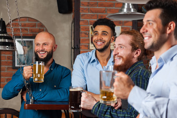 Man Group In Bar Happy Smiling And Watching Football, Drinking Beer Hold Mugs, Mix Race Cheerful Friends