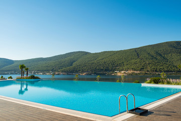 Fototapeta na wymiar Nice swimming pool outdoors on bright summer day