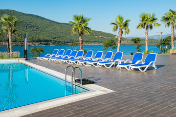 Nice swimming pool outdoors on bright summer day