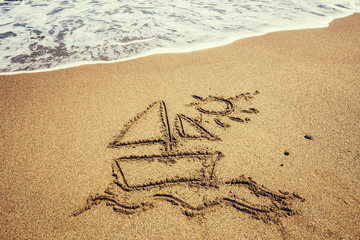 Ship painted on sand beach