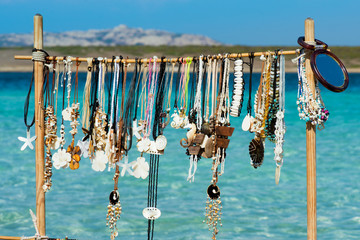 necklaces hanging on the beach
