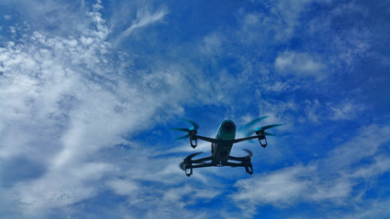 blue drone flight on the blue sky