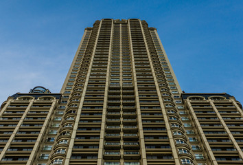 Fototapeta premium Skyscraper in Puerto Madero neighborhood in Buenos Aires against blue sky 