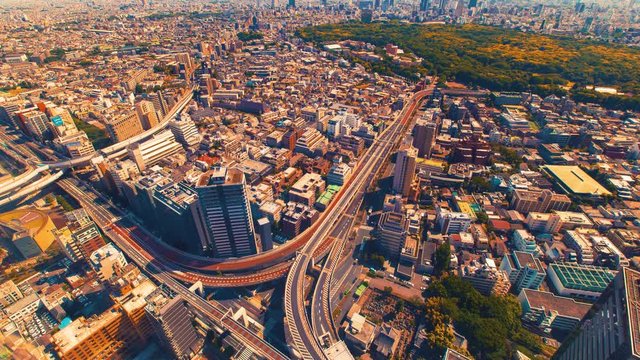 Aerial view time-lapse of a massive highway intersection in Shinjuku, Tokyo, Japan.