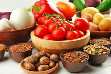 Vegetables and spices on wooden table, closeup
