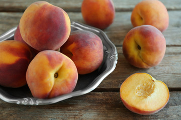 Fototapeta na wymiar Fresh peaches on a wooden background