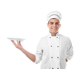 Young handsome chef cook with plate isolated on white