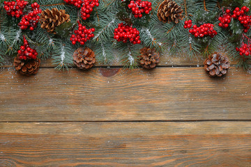 Christmas fir tree on wooden background
