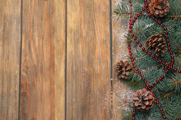 Christmas fir tree on wooden background