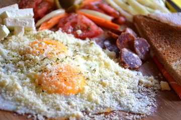 Delicious egg breakfast/Delicious egg breakfast with vegetables on wooden plate with yellow background