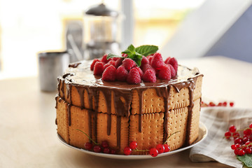 Cookie cake with melted chocolate and raspberries