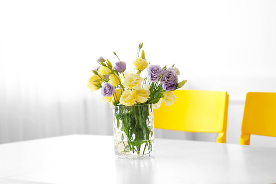 Bouquet of fresh eustoma flowers on table