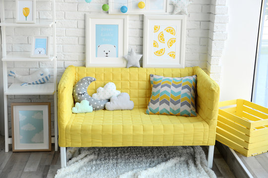Children room interior design with yellow sofa