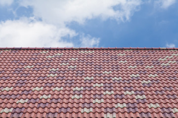 Red and brown roof tile and nice blue sky